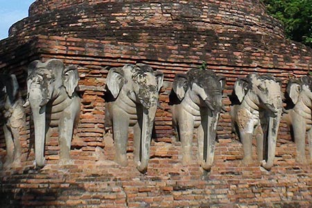 Elephants around the base of the stupa at Wat Sorasak, Sukhothai
