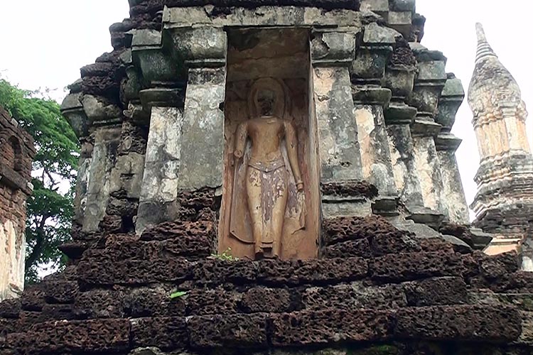 Standing Buddha Image in a niche, in one of the smaller stupas, Wat Chedi Jet Thaew