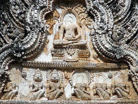 Seated Buddha Image (meditation posture) with disciples below - Pediment on the prang, Wat Phra Phai Luang, Sukhothai.